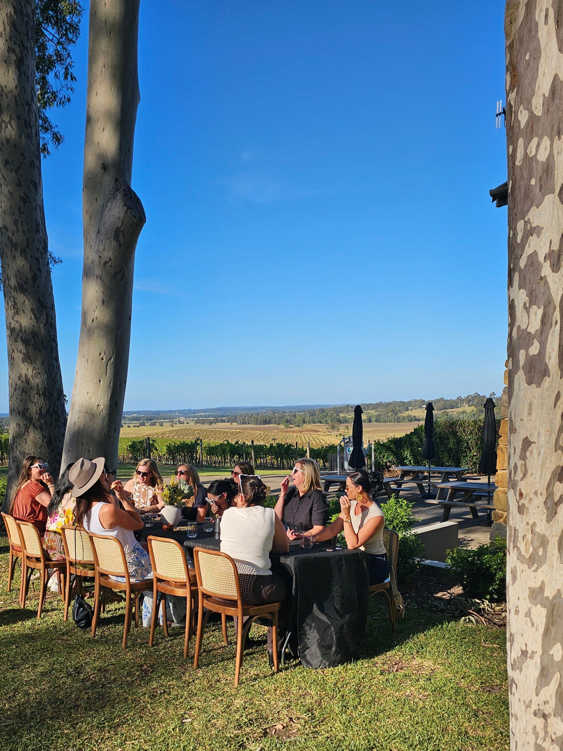 Women laughing and exploring together on a group travel trip with Wander Beyond Co